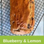 blueberry and lemon loaf on cooling rack on aqua wood table pin