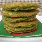 pile of green tinged spinach and corn pikelet batter made in Thermomix on green napkin with green and white squared background