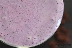 above shot of glass of thermomix banana blueberry smoothie