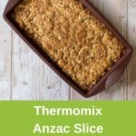 thermomix anzac slice in brown silicon form on white wood pinterest image