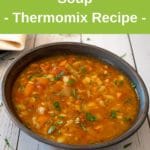 thermomix vegetable soup in bowl on white wood table, green banner above with recipe title, thermobexta logo below image