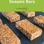 sesame bars lined up on black slate tile, green pinterest banner