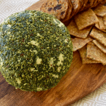 jalapeno cheese ball on board with crackers