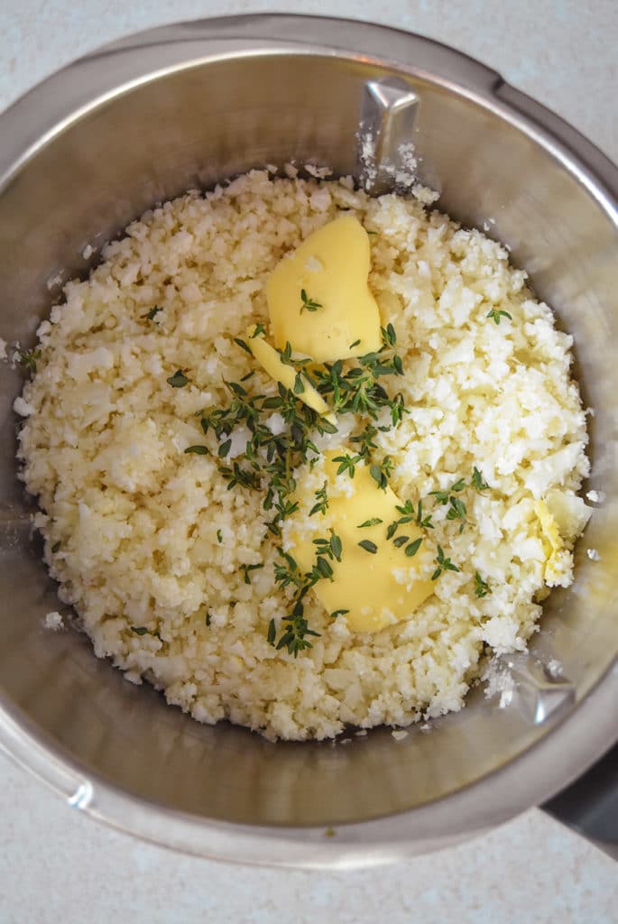 chopped cauliflower, butter and thyme in thermomix bowl