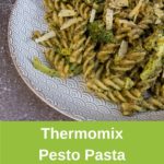 Plate of pesto and broccoli pasta, banner for pinterest