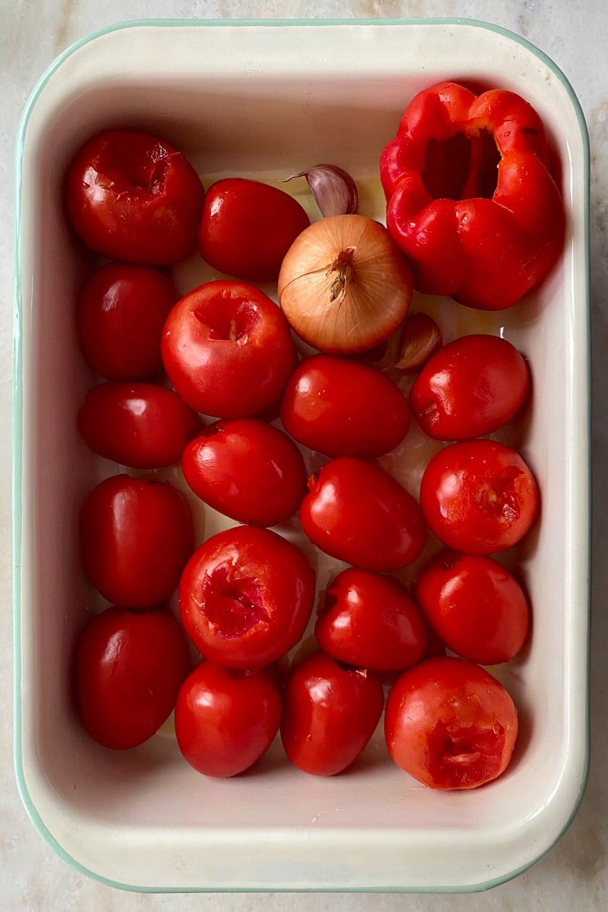 Baking dish of tomatoes, capsicum, onion, garlic for thermomix tomato ketchup