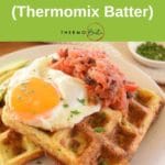 savoury waffles thermomix on white plate topped with fried egg and salsa, fork and parsley in background pin