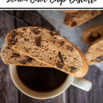 biscotti pin with 'Thermobexta thermomix lemon choc chip biscotti' title. Cup of black coffee with two slices of biscotti on top, Birdseye view with more biscotti on rack in background. Wooden backdrop. Black strip along bottom with thermobexta logo in it