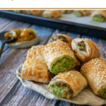 spinach and cheese rolls on rustic cream coloured plate on wooden background with text 'thermomix spinach and three cheese rolls thermobexta'