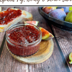 text 'thermomix spiced fig, honey and lemon jam' at top, then image of jam in jar on wooden table with figs in background, view from side angle. Thermobexta logo in black strip along bottom