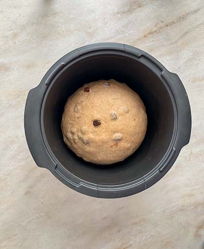 hot cross bun dough on stone bench top, prior to rising