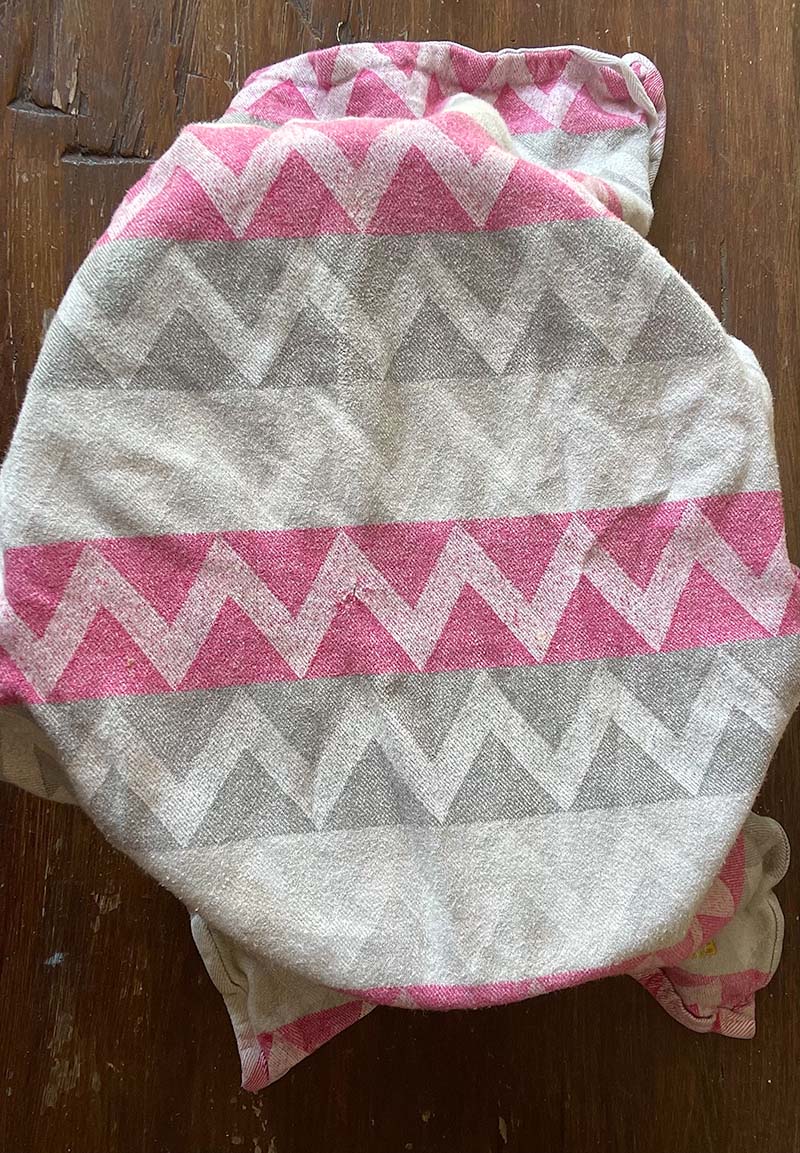 tea towel covering bowl on wooden surface