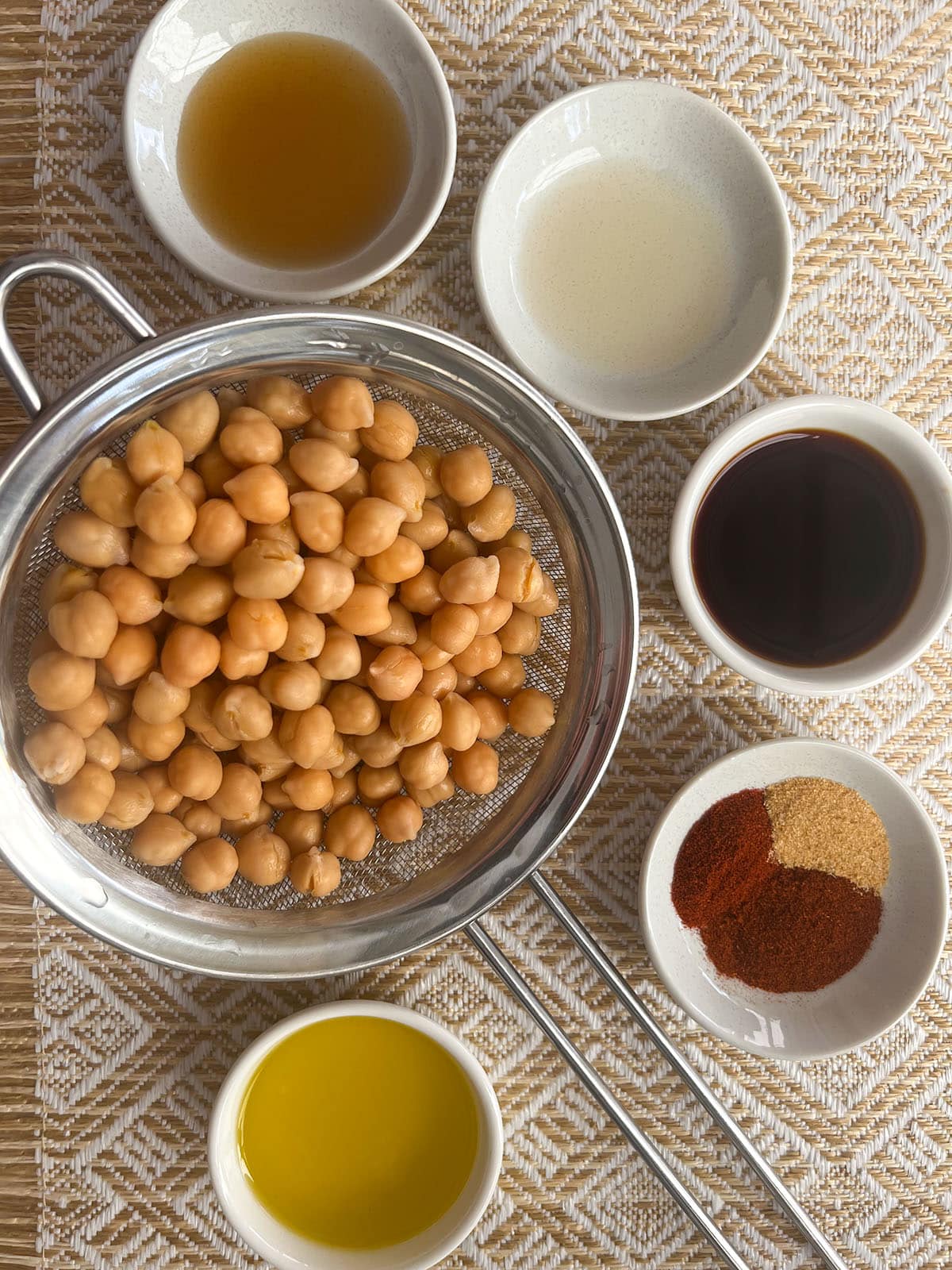 vegetarian cobb salad chickpeas and small dishes of spices and flavouring ingredients