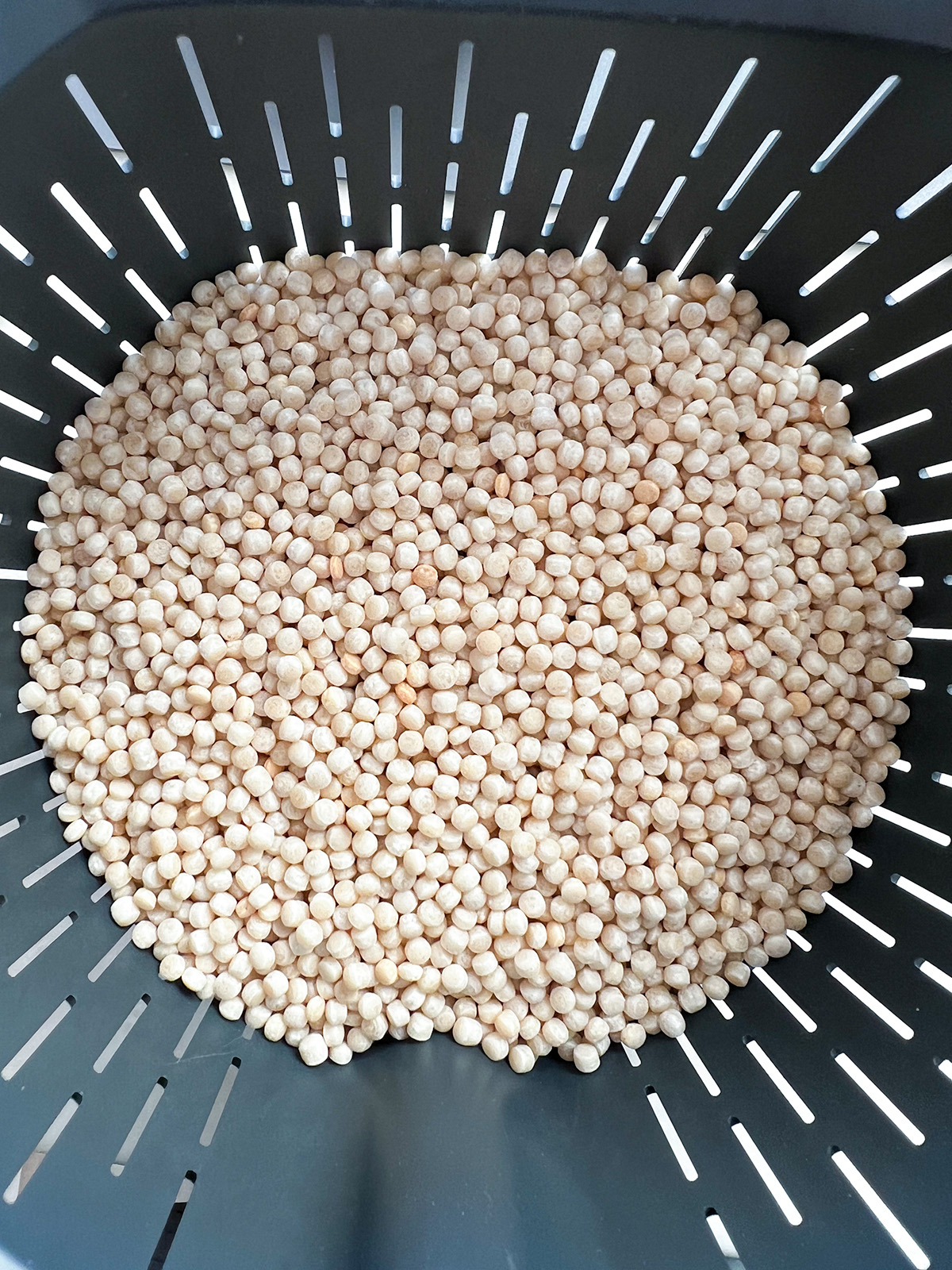 uncooked pearl couscous in thermomix basket