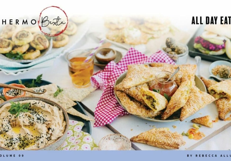 thermomix all day eats lunch box entertaining snacks cookbook lots of food on a table, pops of colour from fabrics